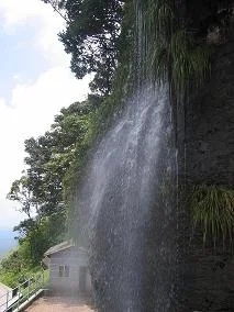 Manikyadhara Falls dropping over the rock face beside its viewing platform